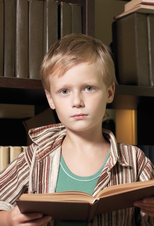 The boy reads the book.の写真素材