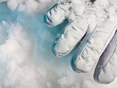 Buried alive. Need help. One glove in snowdrift with deep blue shadows. の写真素材