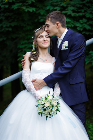Groom kissing brideの写真素材