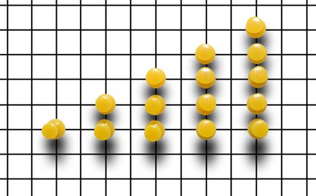 Yelolow drawing pin diagram on a plaid backgroundの写真素材