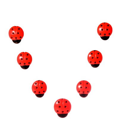 Seven  red button in ladybug form. Order in letter の写真素材