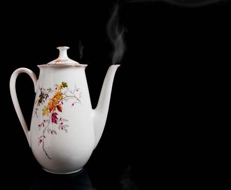 White big kettle  on blackの写真素材