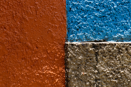 Red, blue and brown wall textureの写真素材