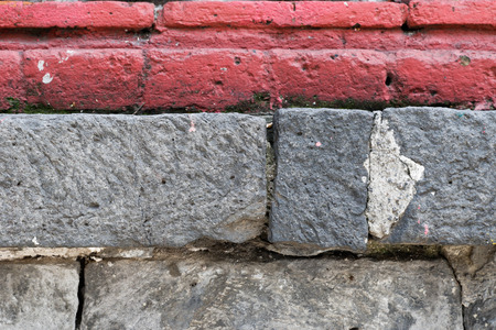 Red brick and grey stone brick wall textureの写真素材