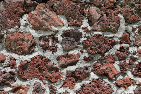 Red volcanic rock wall textureの写真素材