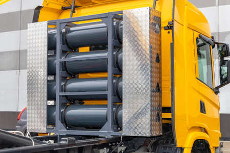 Compressed natural gas cylinders behind the truck cab. Truck with a methane engine. CNG as a fuel....