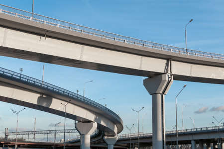 New turning automobile overpasses, bottom view. Modern road infrastructure