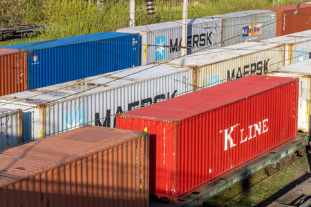 Freight train with cargo containers Maersk and other carriers. International container cargo...