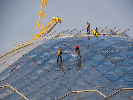Group of workers climbers wash the glass dome in the park Zaryadye. Work at height. Moscow, Russia -...