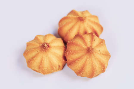 Three shortbread cookies on a light background. Confectionery. Sweetness. Unhealthy foodの写真素材
