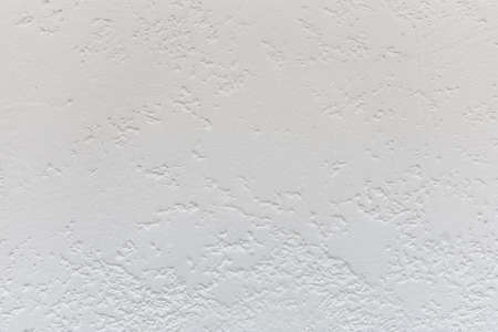 Uniform rough texture of gray plaster. Rough surface coating, decorative wall decoration. Design and interior decoration of residential premises. Texture or background for designの写真素材