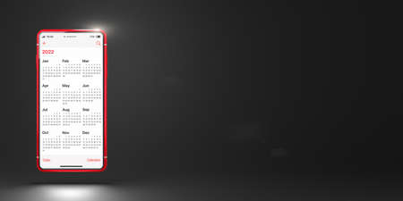 Red mobile phone with the application Calendar 2022 on a black background. Calendar app on smartphone screen and space for placing text. Business or time management conceptの写真素材