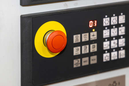 Red emergency stop button on the control panel, close-up. Machine control panel. Selected focusの写真素材