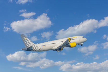 Vueling Airbus A320 taking off against a cloudy sky. International Airlines. Domodedovo Airport, Russia - July 18, 2014のeditorial素材