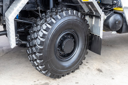 A new rubber truck tire or an off-road vehicle. Off-road capability, the tread or protector. Auto...