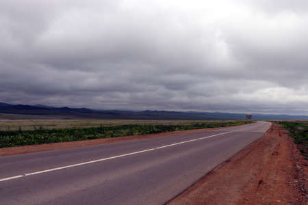 asphalt road in the mongolian steppe Mongoliaの写真素材