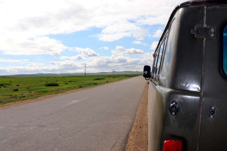 asphalt road in the mongolian steppe Mongoliaの写真素材