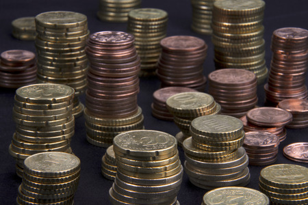 a lot of different high stacked heaps of Euro-Cent coins