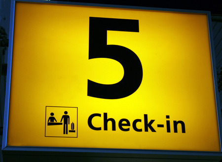 check in sign at airport with number fiveの写真素材