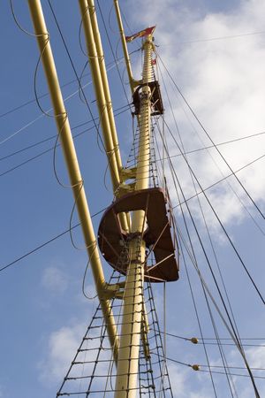 Old wooden mast of antique sailing ship