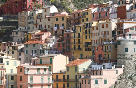 beautiful town of Corniglia in cinqueterre in Italy with many colorful houses built on a cliff
