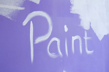 word paint painted in white on purple wallの写真素材