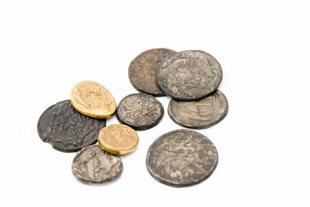 Different kinds of antique roman coins on white backgroundの写真素材