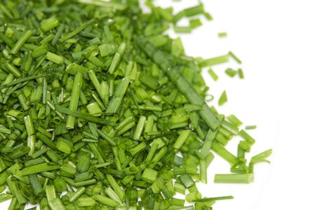 pile of chopped chives isolated on whiteの写真素材