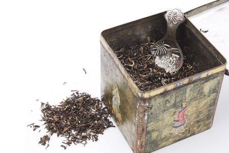 Himalayan tea leaves in old chinese tea box with antique silver teaspoon and some tealeaves on the sideの写真素材