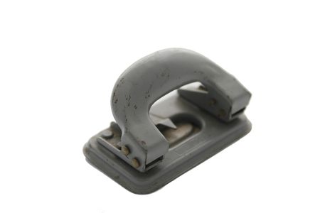 Vintage grey perforator isolated on whiteの写真素材