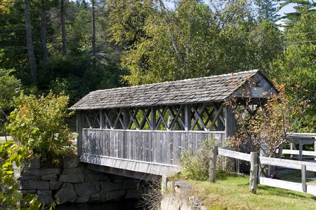 Beautiful wooden covered bridge in rural landscapeの写真素材