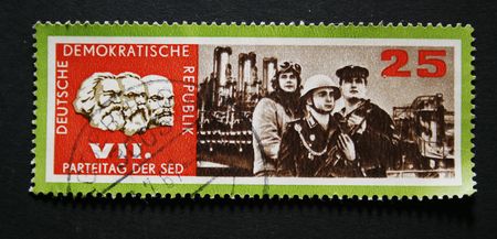 Old east German postage stamp with images of Marx, Engels and Leninのeditorial素材