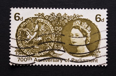 British postage stamp of 1965 to commemorate the 700th anniversary of Parliament with an image of Queen Elizabeth のeditorial素材