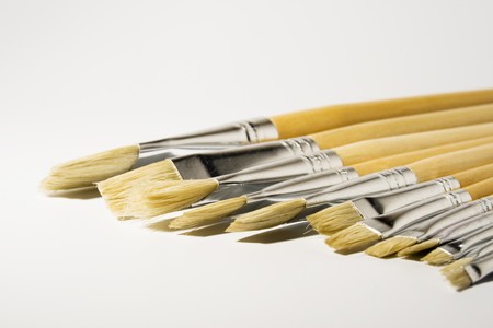 A row of different sizes of paintbrushes 