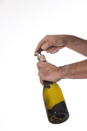 Man opens a bottle of wine with professional cork screwの写真素材