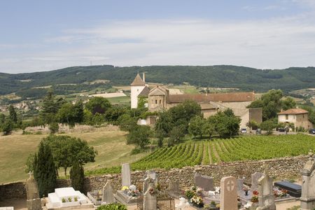 Typical French village in Burgundy with vineyards, church and cemeteryの写真素材