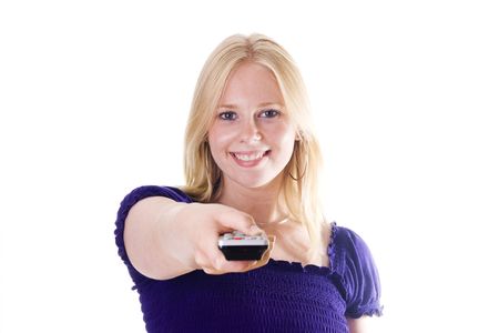 Blonde woman directing remote control on cameraの写真素材