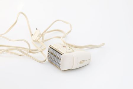 Fifties electric shaver with cable on whiteの写真素材