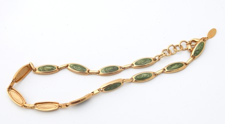 Golden bracelet with jade inletsの写真素材