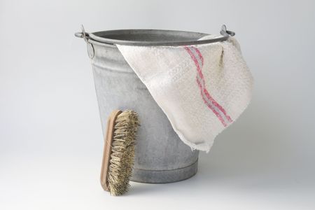 Old zinc bucket with floorcloth and brushの写真素材