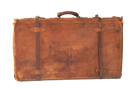 Isolated old and weathered leather suitcase standingの写真素材
