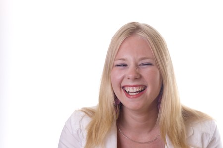 Young blonde girl laughing out loudの写真素材