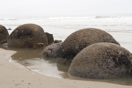 Boulders on beach of Moeraki in New Zealandの写真素材