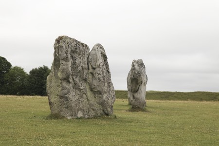 The famous ancient stone circle  at Avebury in Wiltshire with a male and a female stone. The male stones are straight, the female stones more diamond shaped. Built in neolithic times for religious purposes. の写真素材