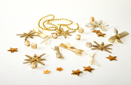 Golden christmas decoration on a white backgroundの写真素材
