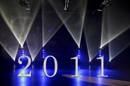 Blue and white spotlights on a stage with 2011 の写真素材