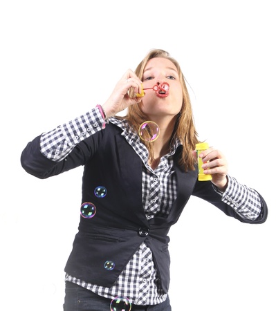 Young woman blowing bubblesの写真素材