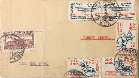 Big brown envelope with many Mexican postage stamps sent as airmail via New York