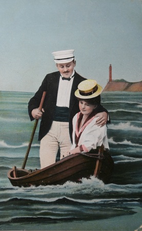 Nostalgic love- lovers in fake rowingboat-circa 1909 postcard,のeditorial素材