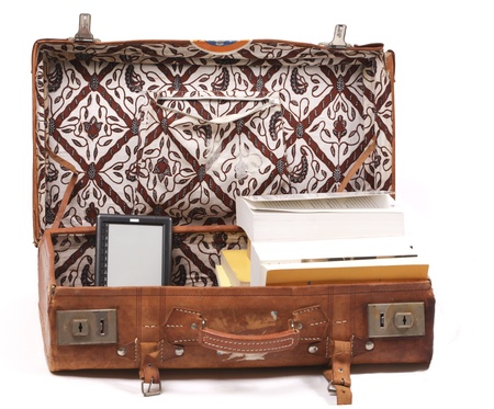 Full suitcase with books and ebook